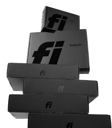 Six black Fi boxes stacked in a pile