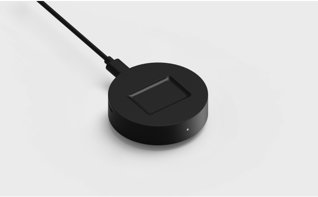 Top view of the black Fi Series 3 Base with a USB-C cord