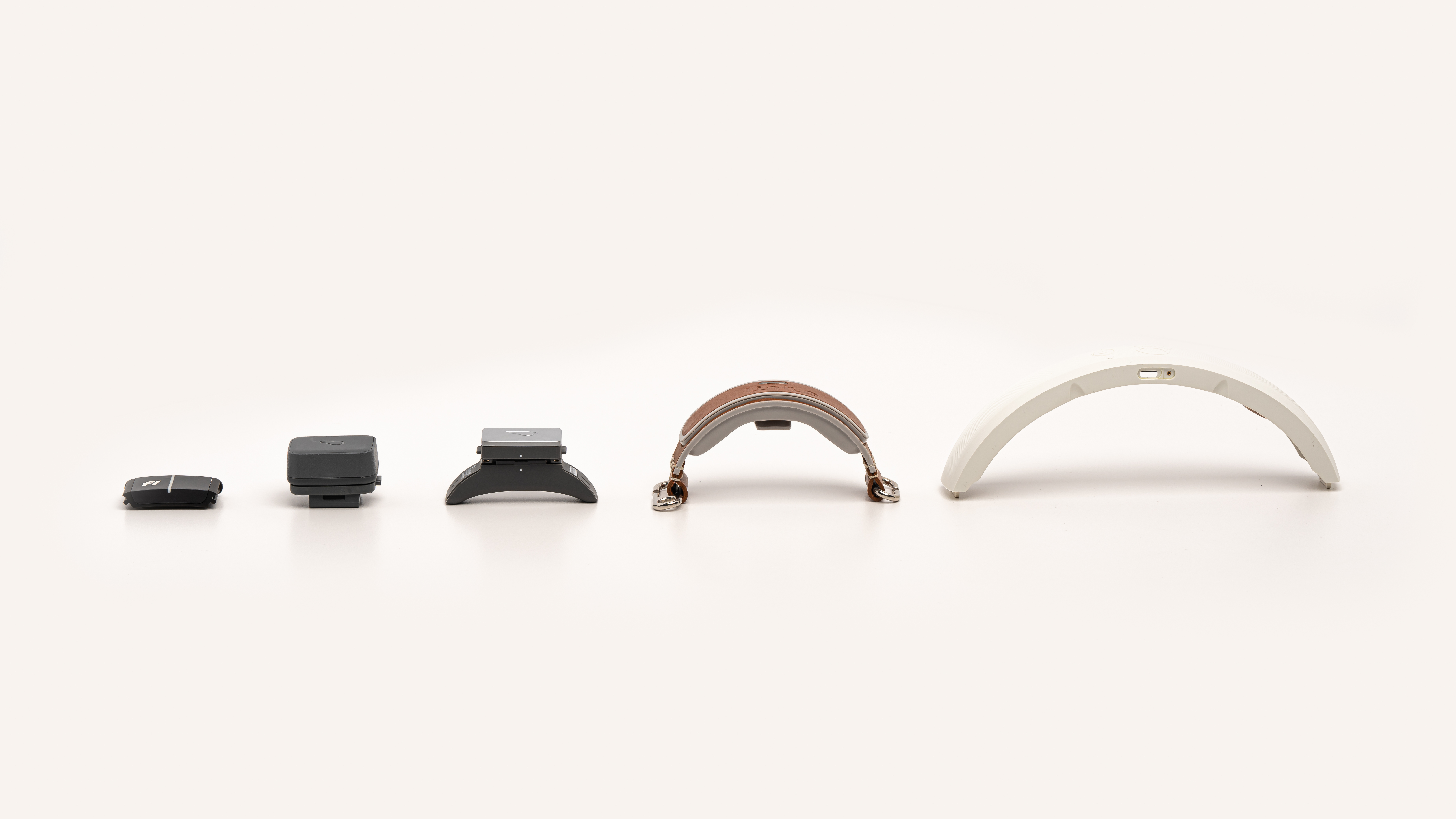 Size comparison of five pet tracking devices arranged smallest to largest
